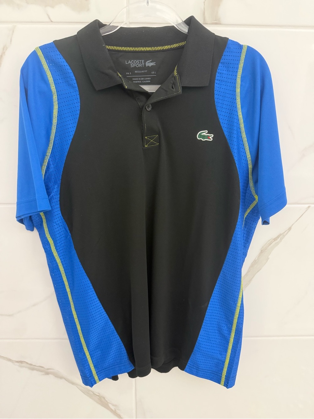 Lacoste Black Polo with Blue Panels and Green Accents
